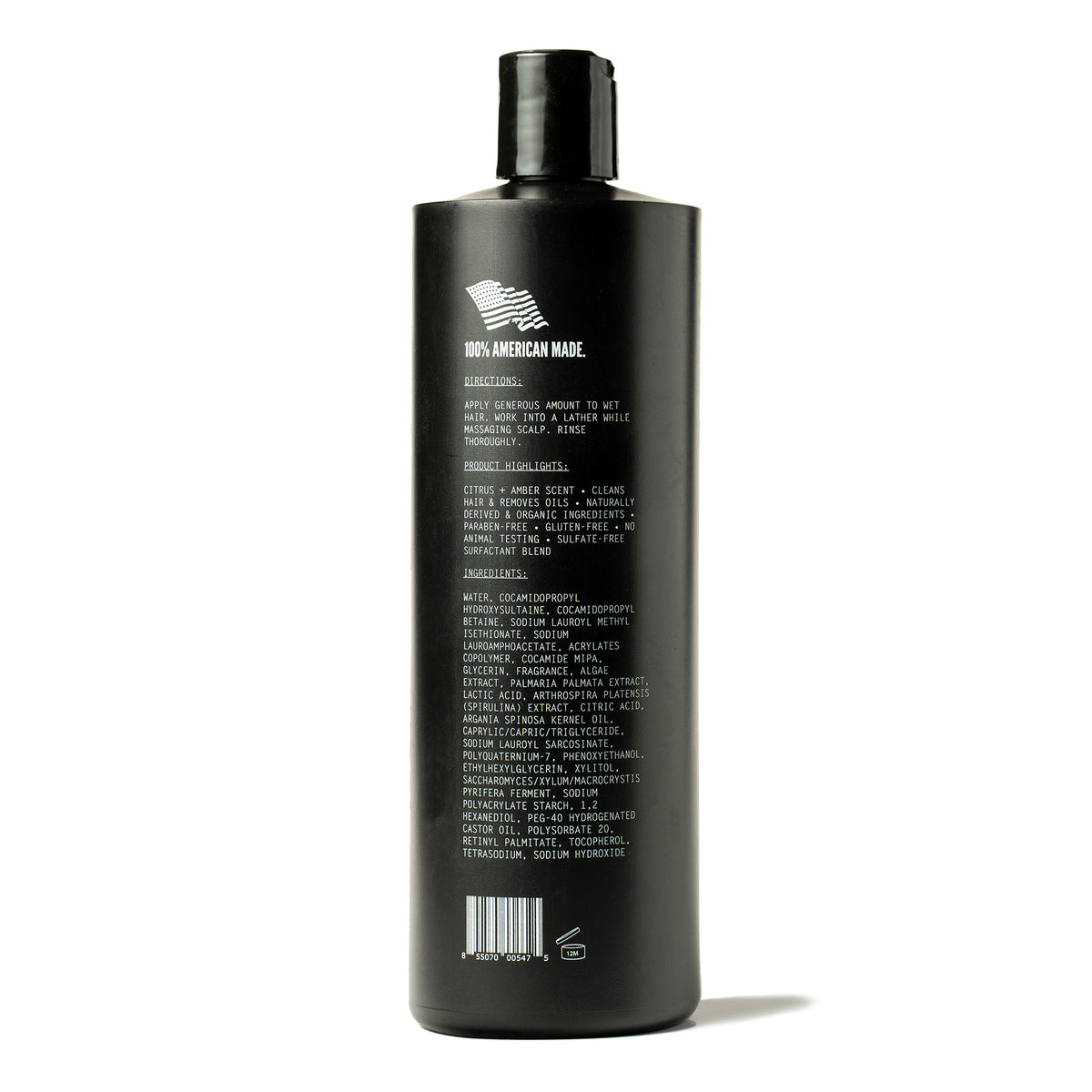 Back label of Imperial Luxe Shampoo showing directions, product highlights including citrus and amber scent, and a full ingredients list on a dark bottle.