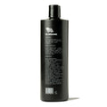 Back label of Imperial Luxe Shampoo showing directions, product highlights including citrus and amber scent, and a full ingredients list on a dark bottle.