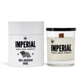 Imperial Barber Grade Products scented candle in a clear glass with a wood wick, shown beside its white cylindrical gift box marked 100% American Made.