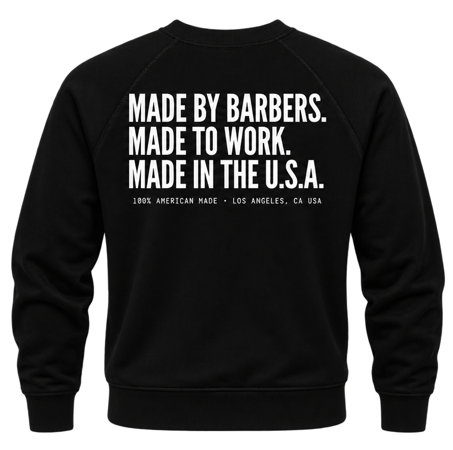 Back of the black Imperial Barber Grade Products crewneck sweatshirt, printed with "Made by Barbers. Made to Work. Made in the U.S.A." and "100% American Made, Los Angeles, CA USA".