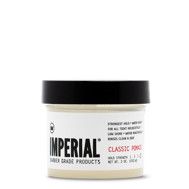 Front view of the Imperial Classic Pomade 2 oz travel-size tub with black lid, showing strongest-hold, water-based formula label.