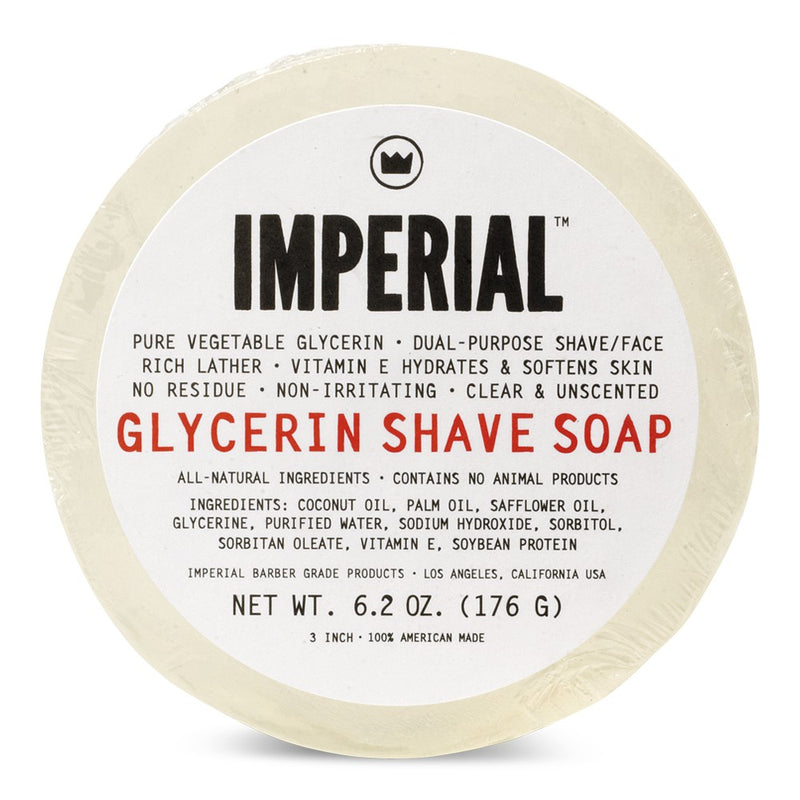 Top-down view of the Imperial Barber Grade Products Glycerin Shave Soap puck, 6.2 oz, showing the full ingredient list and clear unscented soap visible around the label.
