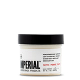 Front view of the Imperial Matte Pomade Paste 2 oz travel-size tub with black lid, showing light-to-medium hold, no-shine finish label.