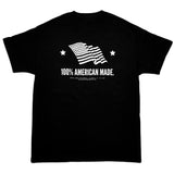 Front of a black Imperial Barber Grade Products t-shirt printed with a waving American flag graphic and the text "100% American Made.".